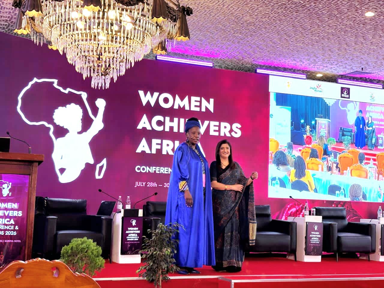 Dr. Sarita Sukhija on stage with the host at Women Achievers Africa Conference 2026