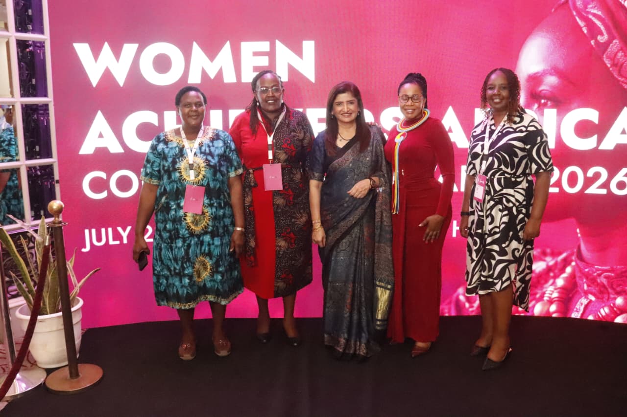 Dr. Sarita Sukhija with conference delegates in front of the Women Achievers Africa 2026 backdrop